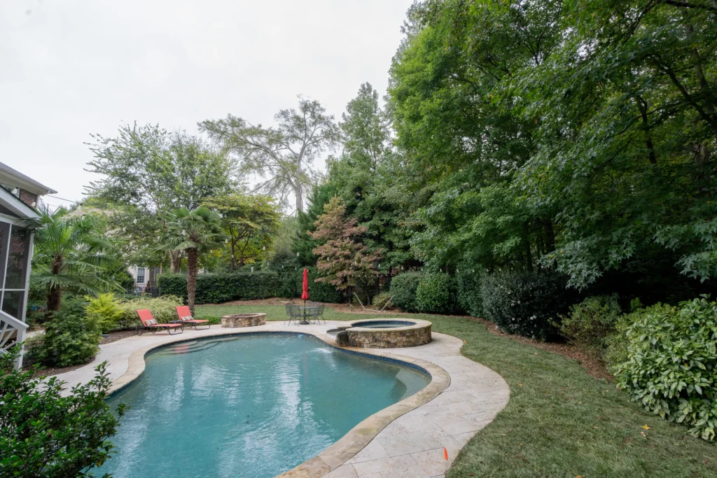 Travertine reset and mulch bed refresh Weddington NC